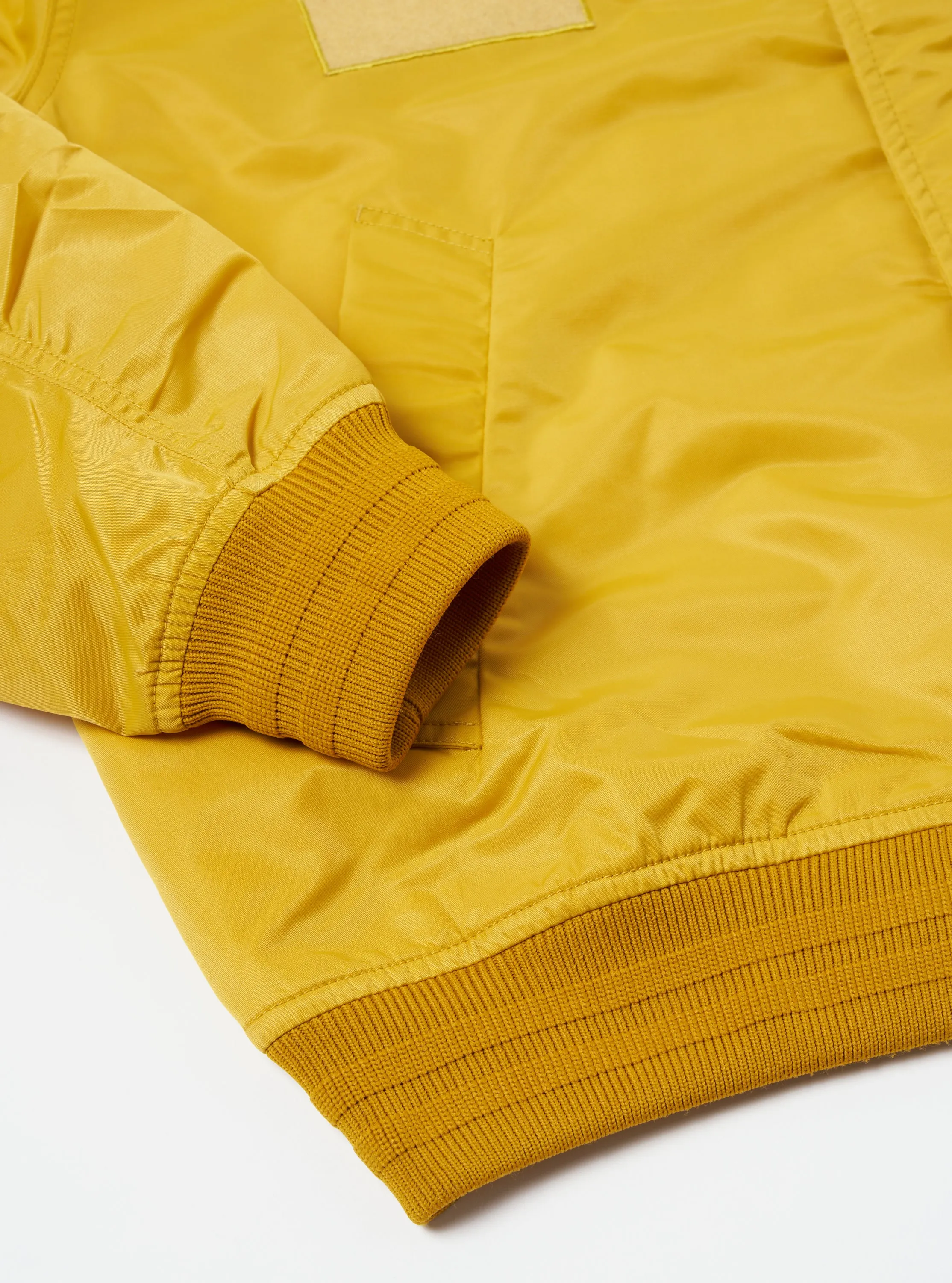 Universal Works Badge Bomber in Yellow Flight Nylon